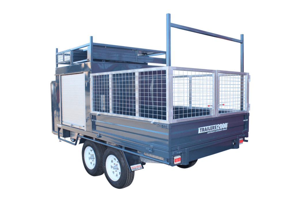 Custom Trailer Manufacturers at Trailers 2000 designed this trailer featuring a trailer cage, ladder racks, and storage compartments